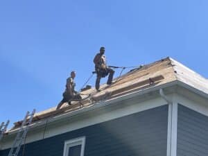 Calgary Roofers | The Owners working on a roof